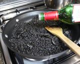 A picture of step 6 of Paella with Squid and Squid Ink.