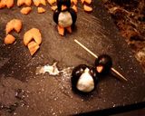 A picture of step 8 of March of the penguins, olive and cheese bites.