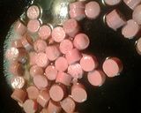 A picture of step 4 of Udon noodles with egg and Vienna sausages.