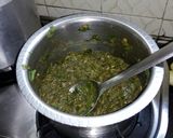 A picture of step 1 of Colacasia & green sorrel curry (alu chi bhaji).