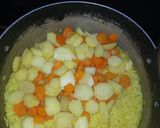A picture of step 2 of Yellow rice with sauce.