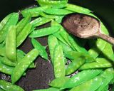A picture of step 3 of Garlic Snow Peas With Lemon Zest and Parmesan.