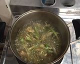 A picture of step 2 of Clear Tom Yum Soup with Three Mushrooms (Vegetarian).