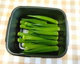 A picture of step 2 of Easy Pork-Wrapped Okra.
