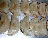 A picture of step 4 of sweet and tart chocolate cherry empanadas.