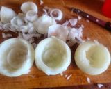 A picture of step 1 of BBQ Bacon-Wrapped Burger-Stuffed Onion Bombs.