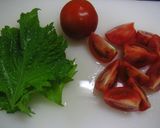 A picture of step 1 of Tomatoes Dressed with Umeboshi Pickled Plums and Bonito Flakes.