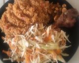 A picture of step 4 of Jollof Rice with salad,pan fried shrimps with fried chicken.