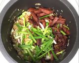 A picture of step 6 of Preserved Duck Meat And Chinese Sausage Fried Rice.