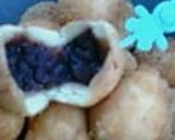 A picture of step 9 of Plain or Chocolate Pon-De-Ring Style Donuts.