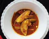 A picture of step 6 of Tangy Mango Drumstick curry.