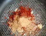 A picture of step 3 of Tandoori chicken rolls up.