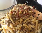 A picture of step 6 of Pasta with Spicy Sausage, Sun-dried Tomatoes & Basil.