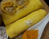 A picture of step 7 of Surul /churul appam (coconut crepe roll).