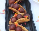 A picture of step 24 of Warm gulab jamun in sweet crunchy tacos.