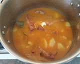 Foto del paso 6 de la receta Costillas adobadas guisadas con patatas, guisantes y zanahorias