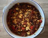 A picture of step 6 of Greek peppers and sausage bake with feta.