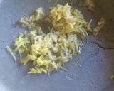 A picture of step 4 of Garlic rice.