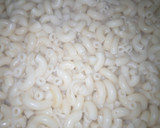A picture of step 1 of Spring onions macaroni jolop😋.