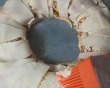 A picture of step 16 of Indian style crescent ring.