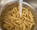 A picture of step 1 of Bobby&Whittney”s Homemade Penne Chicken Alfredo with broccoli and shrimp.