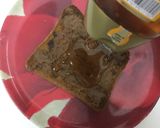 A picture of step 3 of Nutella, honey, and cheese toast.