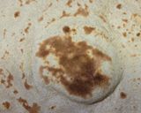 A picture of step 5 of Homemade Roti or Phulka.