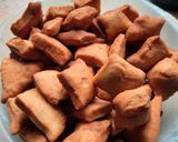 A picture of step 8 of Mandazi-ginger.