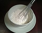 A picture of step 2 of White Chocolate Cupcakes with White Chocolate Whipped Cream Frosting.