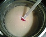 A picture of step 6 of White Chocolate Cupcakes with White Chocolate Whipped Cream Frosting.