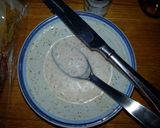 A picture of step 3 of Taisen's english muffin w/tomato, cucumber, cheese and dressing.