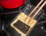 A picture of step 4 of Japanese seaweed tamagoyaki - rolled omelette.