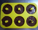 A picture of step 4 of Baked Dark Chocolate Donuts Made with Pancake Mix.