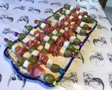 A picture of step 8 of Appetizer Skewers with Green Olives, Tomato, Prosciutto, and Pyrenees Cheese.
