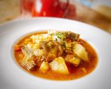 Une image de l'étape 7 de Bacalao con alcachofas i alubias.