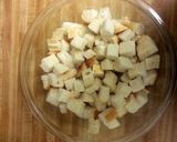 A picture of step 2 of Homemade Herbed Croutons.