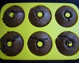 A picture of step 5 of Baked Dark Chocolate Donuts Made with Pancake Mix.