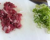 A picture of step 1 of Leek, Pork, and Miso Fried Rice.