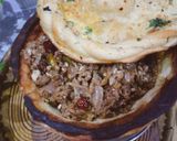 A picture of step 3 of Qeema with bowl Naan.
