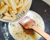 A picture of step 2 of Italian pasta Italian white sauce pasta.