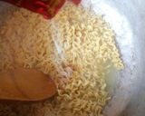 A picture of step 6 of Jollof Vegetable noodles with fried eggs.