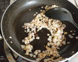 A picture of step 5 of Spinach Corn Ravioli in white sauce.