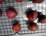A picture of step 9 of red velvet and chocolate covered fried banana balls.