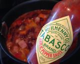 A picture of step 7 of American-Style Texas Chili Pork Beans.