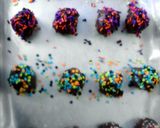 A picture of step 13 of red velvet and chocolate covered fried banana balls.