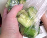 A picture of step 4 of Garlicky Pounded Cucumber Pickles.