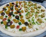 A picture of step 3 of Tikka n kabab pizza.