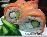 A picture of step 6 of Avocado Salmon Philadelphia Rolls.