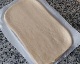 Foto del paso 14 de la receta: Trenza de brioche hojaldrado con crema y cerezas