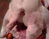 A picture of step 6 of Roasted Duck on a bed of carrots.